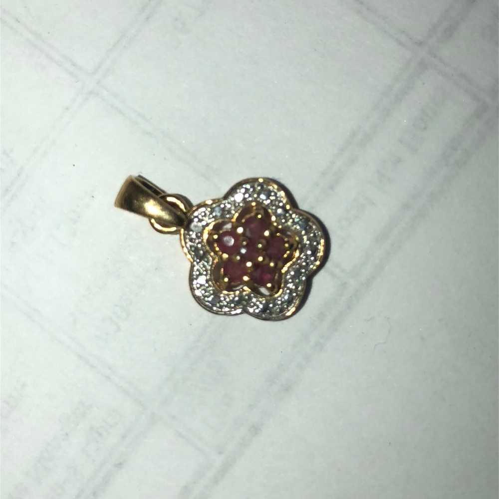 Gold plated 925 stamped ruby heart flower.